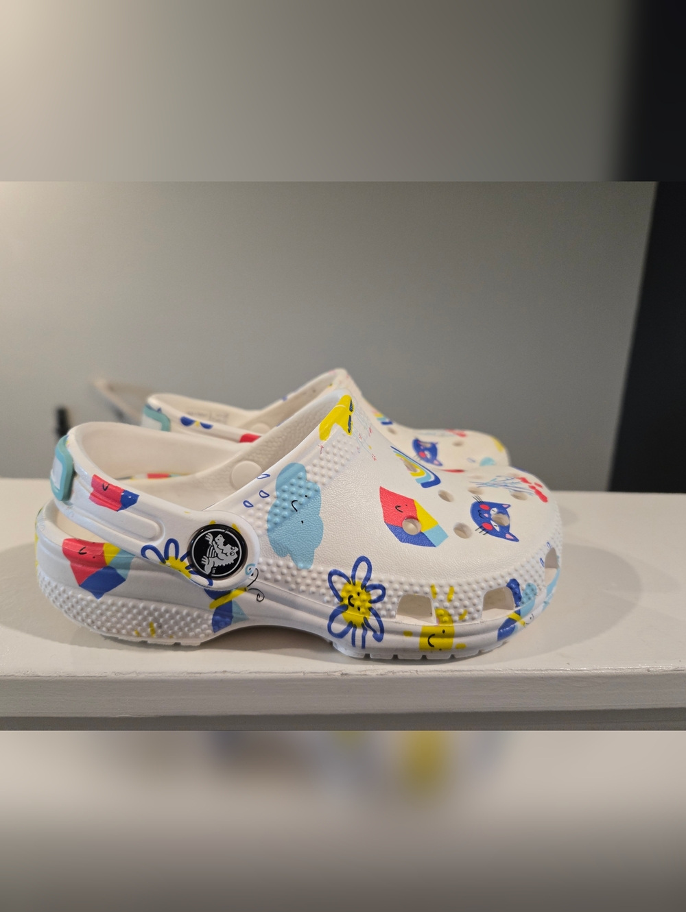 CROCS Kids Size 10c White Clogs with Multicolor Cartoon Prints